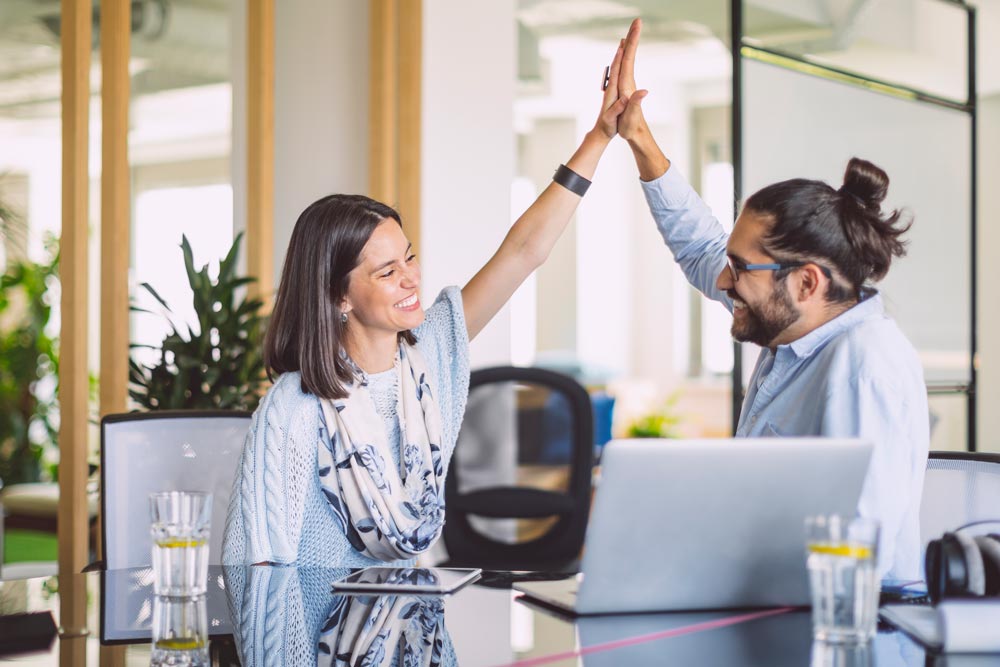 Man and woman high five