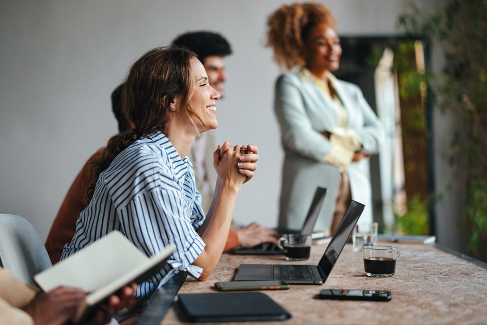 
Happy woman in meeting